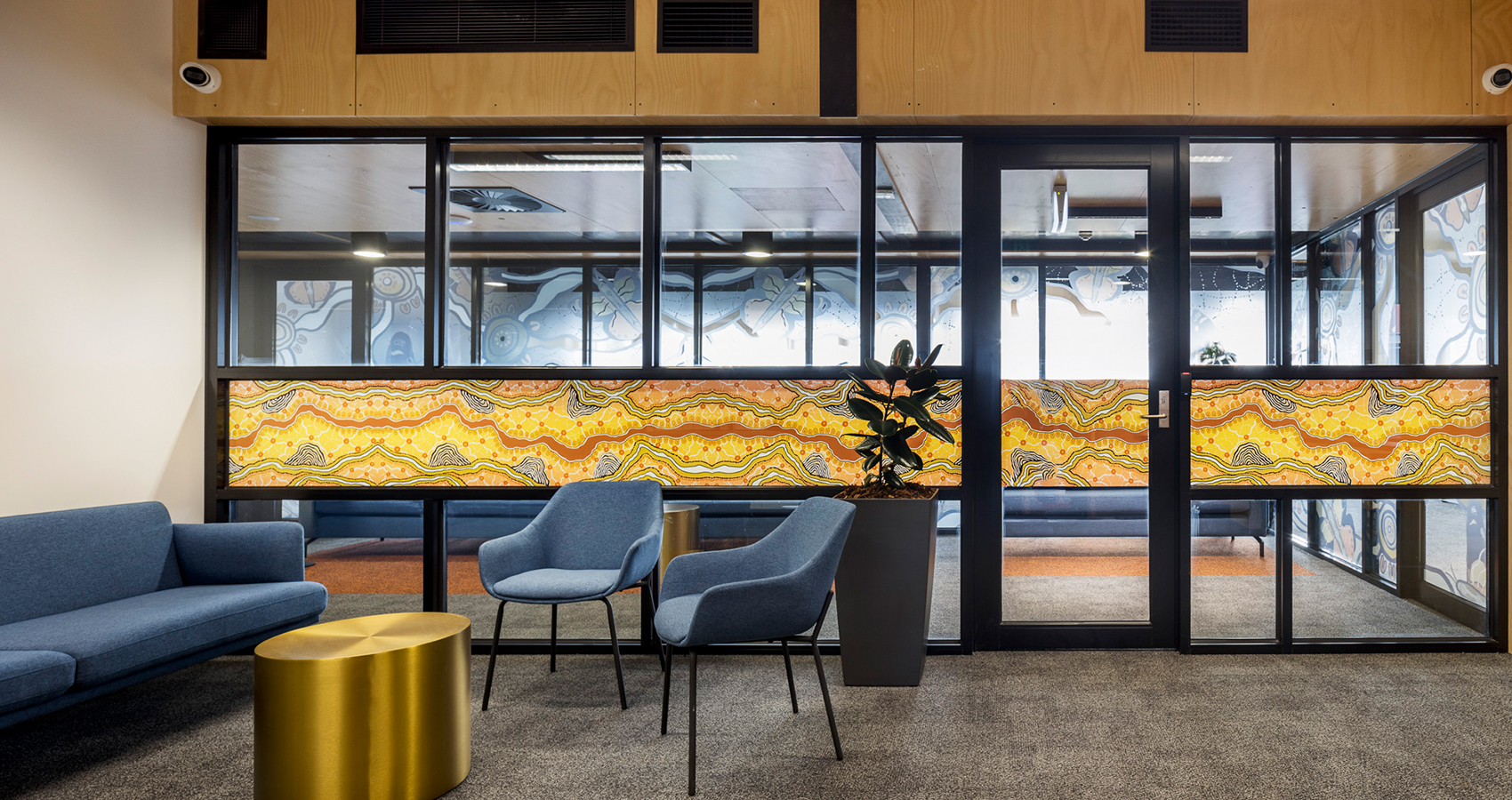 Mac Killop Family Services Project - Hugo lounge in blue with Mali chairs in blue and Drum coffee table in reception area